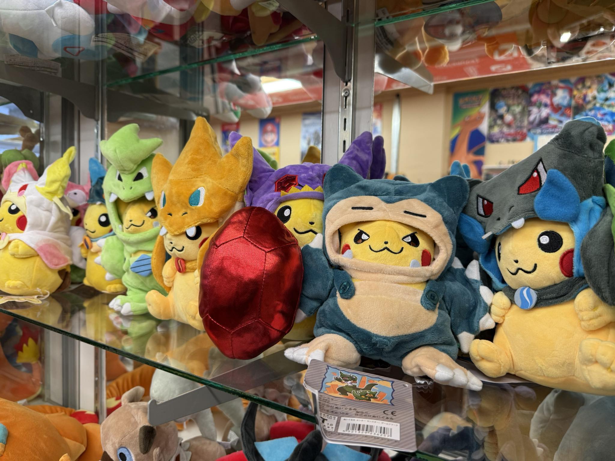 Display case filled with collectible Pokemon plush toys at Uncle Buck's
