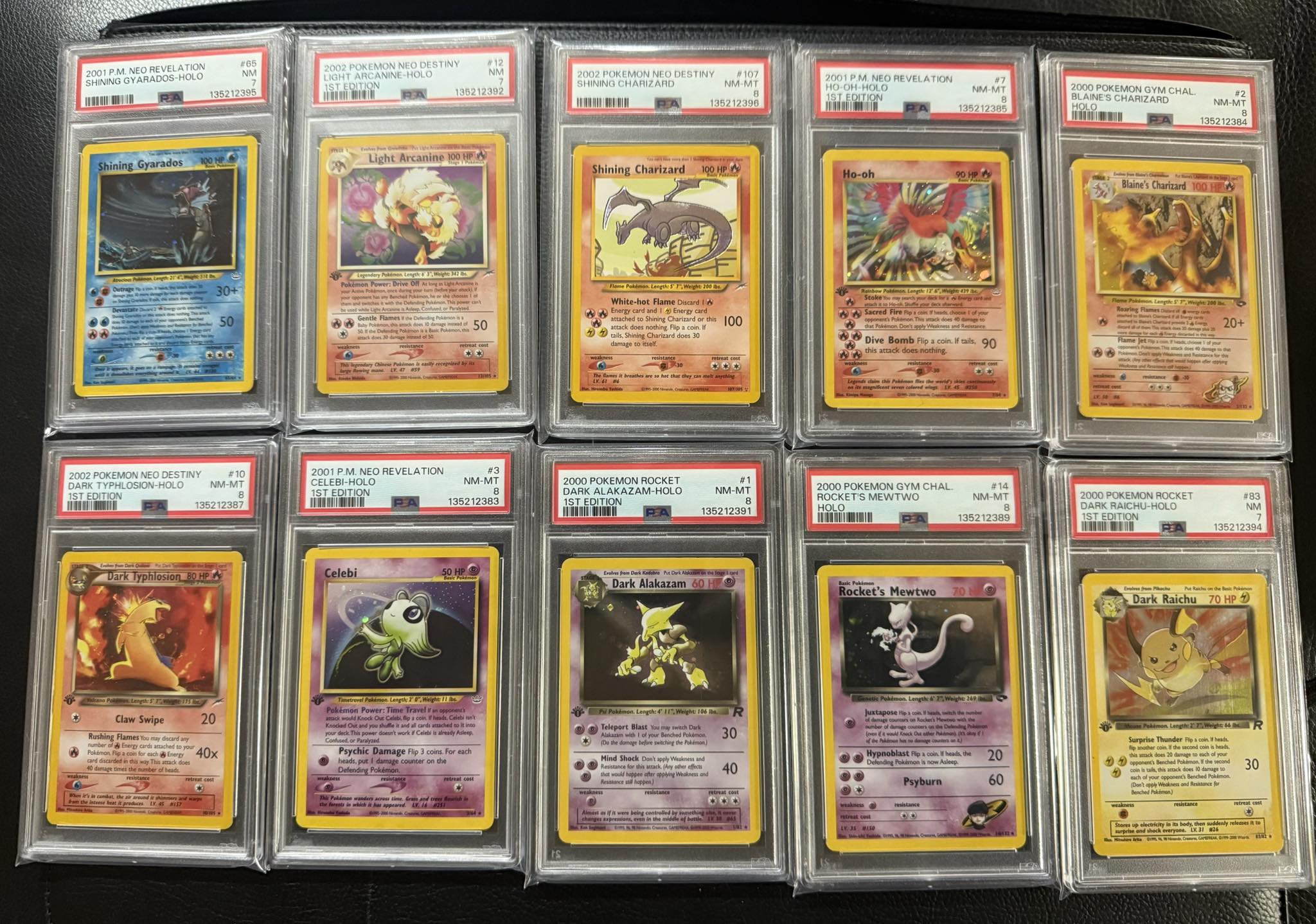 PSA-graded vintage Pokemon cards including Shining Charizard and Neo Destiny holos