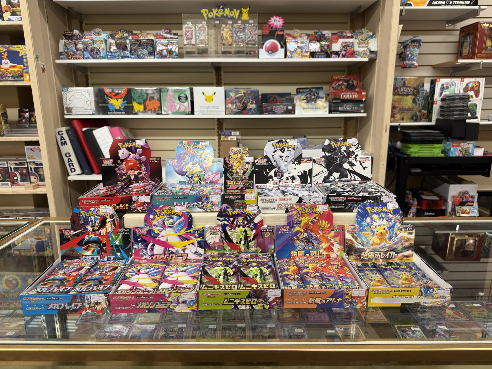 Pokemon booster boxes and sealed product display at Uncle Buck's
