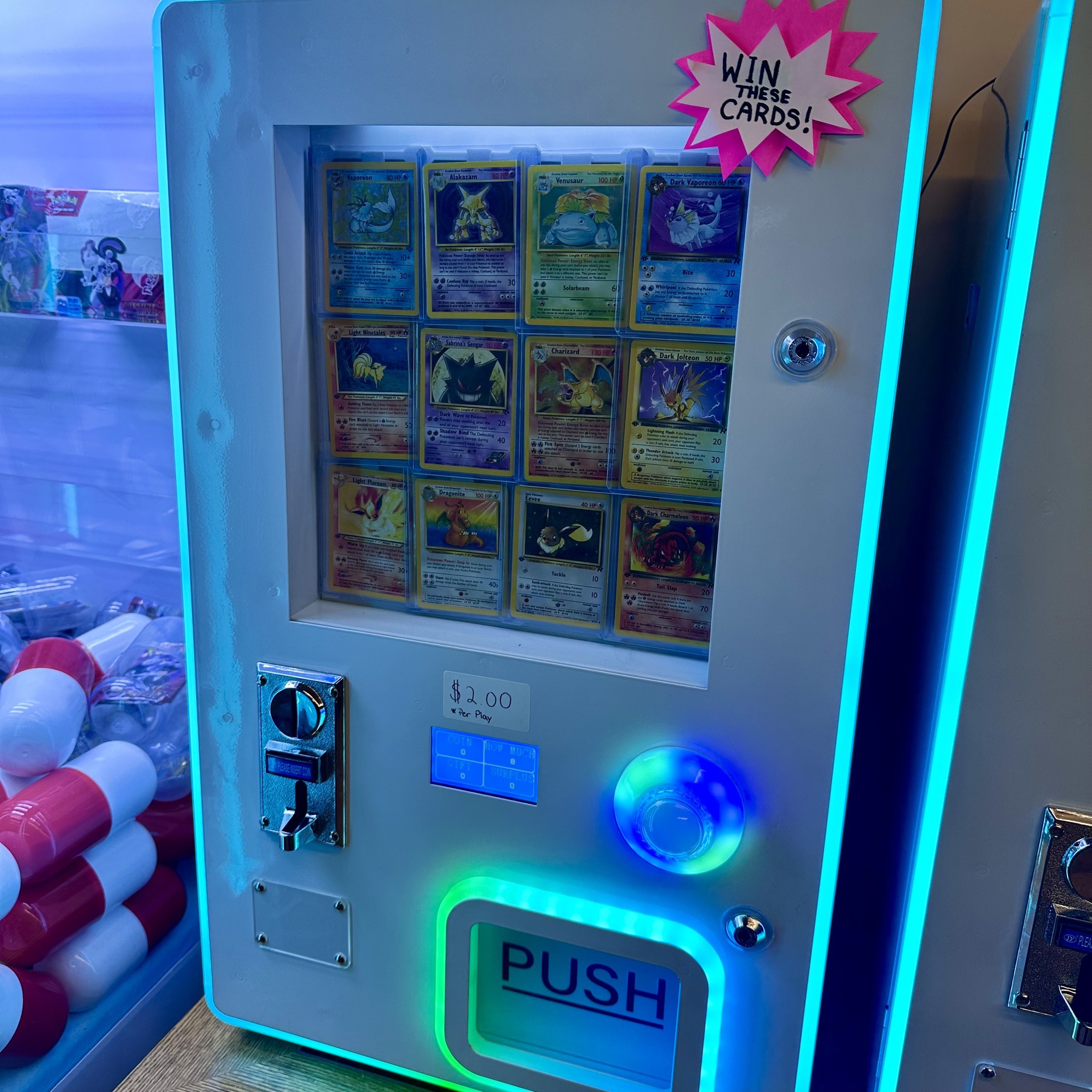 Pokemon card vending machine with classic cards on display
